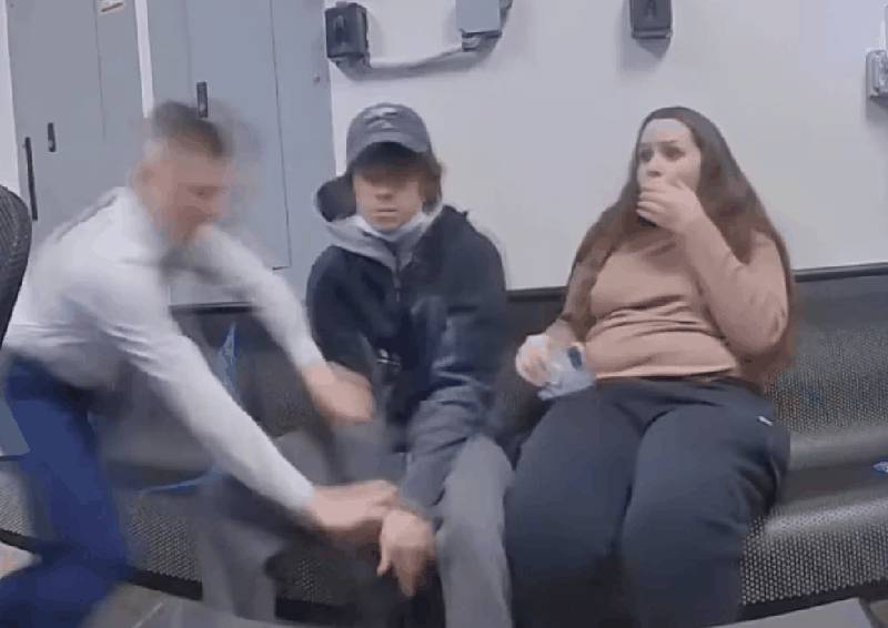 Body cam footage showing Walmart employee tackling suspect Shane Newman as he attempts to fire weapon at officer, while female suspect Katerina Jeffrey reacts in shock