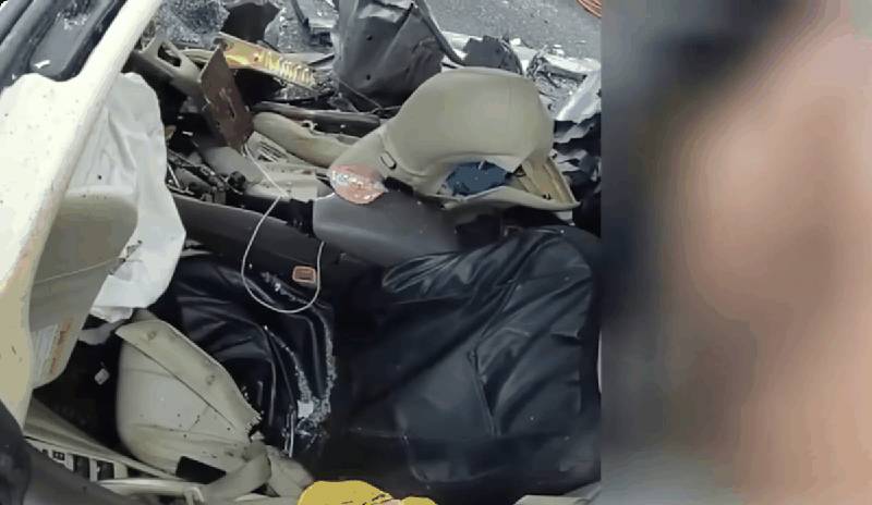 Destroyed vehicle interior showing extent of damage