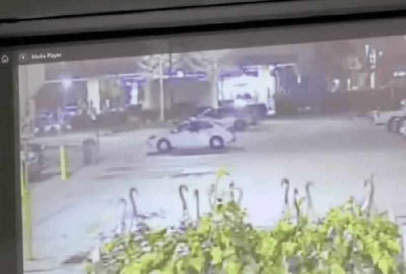 Walmart parking lot surveillance showing white Jeep