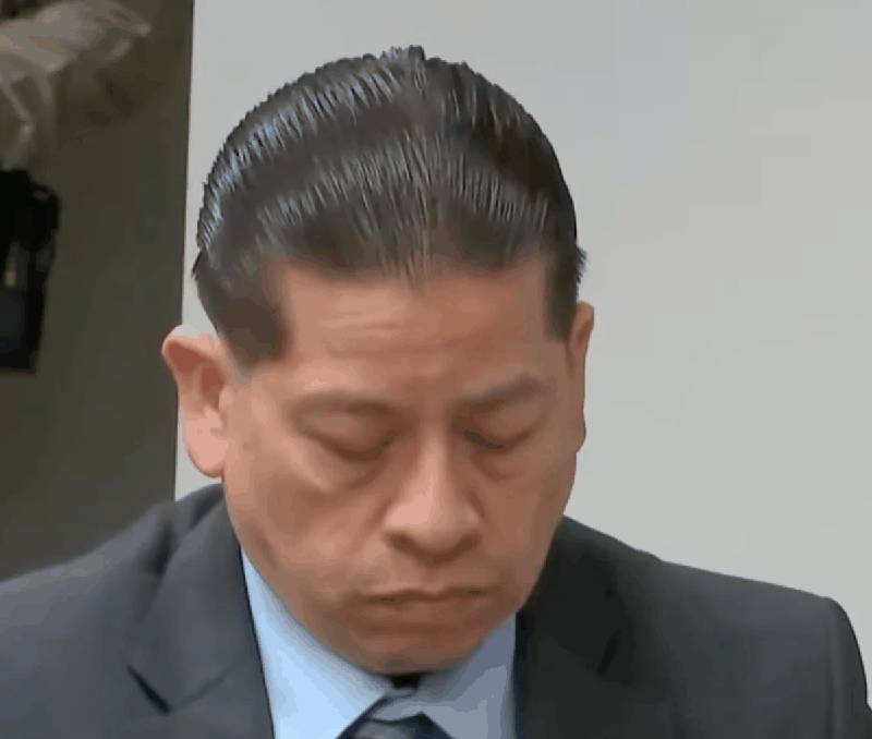 Adrian Gonzales with head bowed