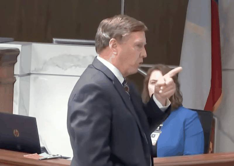 Prosecutor pointing during opening statement in the Adrian Gonzales trial