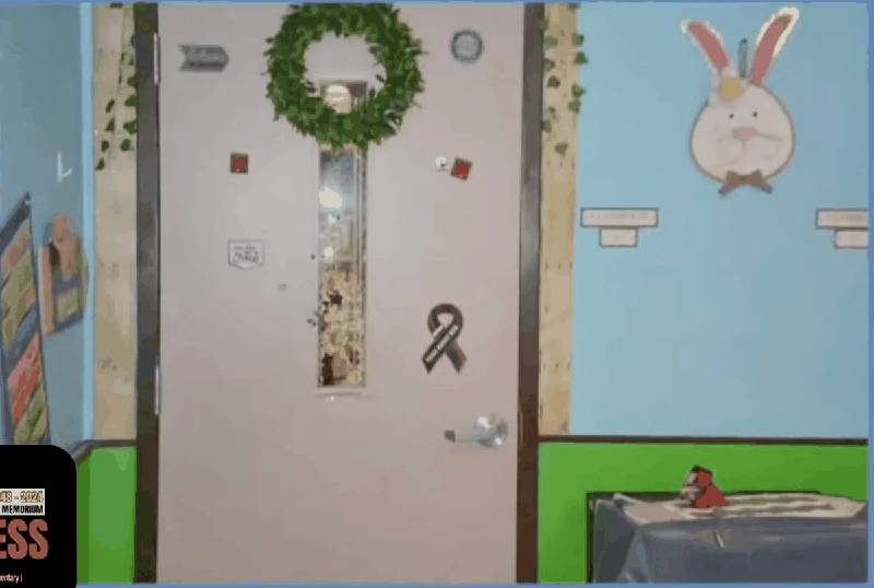 Classroom 112 door at Robb Elementary showing bullet damage to the window