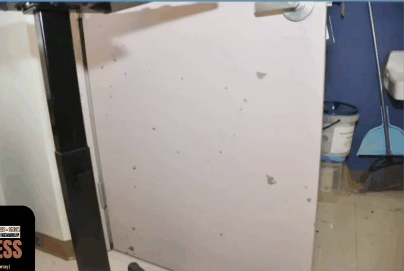 Closet door inside Classroom 112 showing shrapnel damage