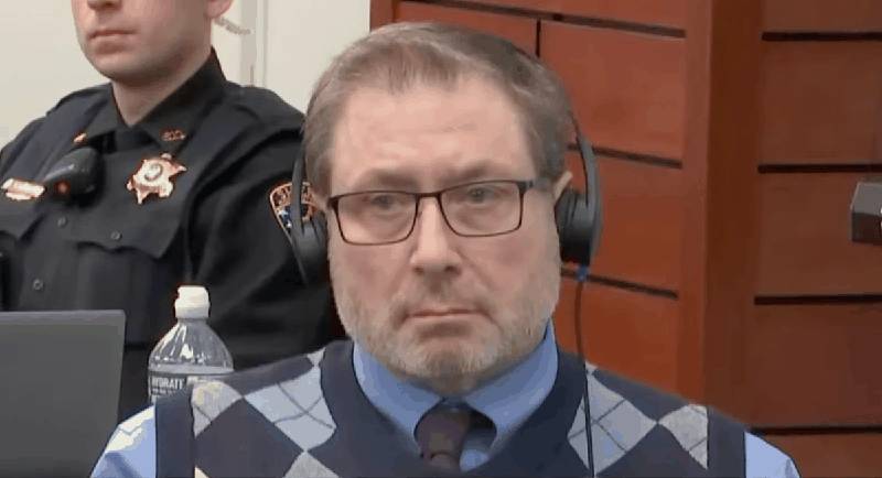Paul Caneiro in court wearing headphones