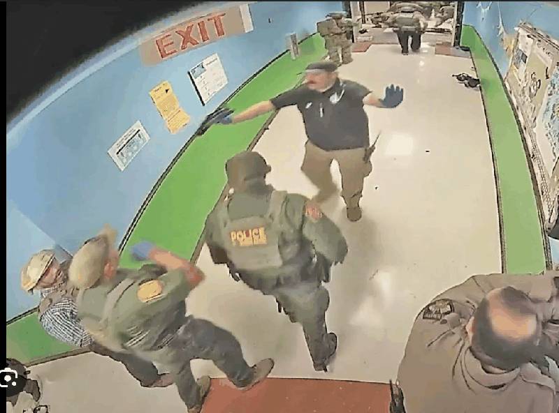 Officers standing in hallway at Robb Elementary School during the Uvalde shooting response