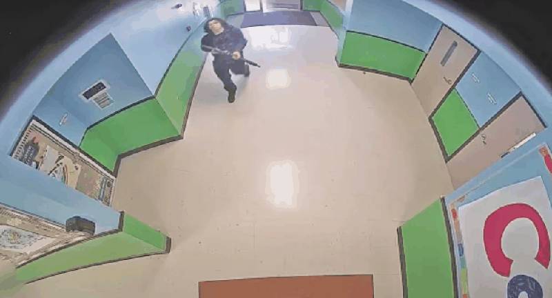 Surveillance footage showing the shooter in hallway of Robb Elementary with rifle