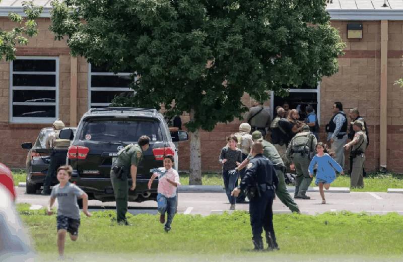 Children being evacuated from Robb Elementary School during the shooting