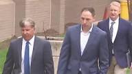 Brendan Banfield leaving court with his attorneys